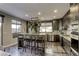 Modern kitchen with marble countertops, stainless steel appliances, and an island at 4412 Desert Park Ave, North Las Vegas, NV 89085