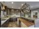 Modern kitchen with marble countertops and wooden island at 4412 Desert Park Ave, North Las Vegas, NV 89085