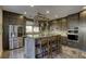 Spacious kitchen featuring dark wood cabinets and granite countertops at 4412 Desert Park Ave, North Las Vegas, NV 89085