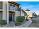 Two story condo building with walkway and landscaping at 451 Sellers Pl, Henderson, NV 89011