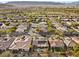 Aerial perspective of a residential area featuring homes, streets, and a golf course at 4618 Atlantico St, Las Vegas, NV 89135