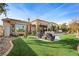 Artificial turf backyard with patio and seating area at 4618 Atlantico St, Las Vegas, NV 89135