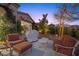 Landscaped backyard with patio furniture and a grill at 4618 Atlantico St, Las Vegas, NV 89135