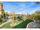 Landscaped backyard with artificial turf and seating at 4618 Atlantico St, Las Vegas, NV 89135