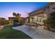 Outdoor entertaining area with patio furniture and putting green at 4618 Atlantico St, Las Vegas, NV 89135