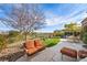 Relaxing backyard with patio furniture and grassy area at 4618 Atlantico St, Las Vegas, NV 89135