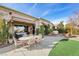 Large backyard patio with seating and dining areas at 4618 Atlantico St, Las Vegas, NV 89135