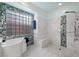 Spa-like bathroom with walk-in shower and soaking tub at 4618 Atlantico St, Las Vegas, NV 89135