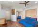 Blue bedroom with a murphy bed and mirrored closet at 4618 Atlantico St, Las Vegas, NV 89135