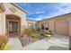 Inviting courtyard entry with decorative gate and seating at 4618 Atlantico St, Las Vegas, NV 89135