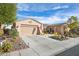 One-story house with a two-car garage and desert landscaping at 4618 Atlantico St, Las Vegas, NV 89135