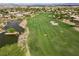 Golf course with a pond, lush green grass, and scenic views at 4618 Atlantico St, Las Vegas, NV 89135