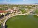 Community clubhouse with lakefront views, lush landscaping, and Spanish-style architecture at 4618 Atlantico St, Las Vegas, NV 89135