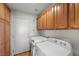 Laundry room with washer, dryer, and ample cabinet space at 4618 Atlantico St, Las Vegas, NV 89135