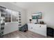 Bedroom with white dresser, TV, and gray striped curtains at 4911 E Parkwood Dr, Pahrump, NV 89061