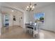 Bright dining area with chandelier and view to backyard at 4911 E Parkwood Dr, Pahrump, NV 89061