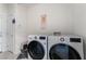 Laundry room with LG washer and dryer, and a cat litter box at 4911 E Parkwood Dr, Pahrump, NV 89061