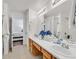 Double vanity bathroom with a large mirror and a tub at 513 Rafkin Pl, Henderson, NV 89052