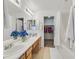 Bathroom with double sinks, a shower, and a walk-in closet at 513 Rafkin Pl, Henderson, NV 89052