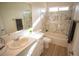 Well-lit bathroom with marble-look shower, tub combo, and single sink vanity at 521 Antelope Ave, Pahrump, NV 89060