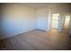 Bright bedroom with a view, closet, and wood-look floors at 521 Antelope Ave, Pahrump, NV 89060