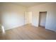 Bright bedroom features wood-look floors and a closet with sliding doors at 521 Antelope Ave, Pahrump, NV 89060