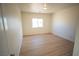 Bedroom with wood-look floors, a window, and neutral paint for a calm space at 521 Antelope Ave, Pahrump, NV 89060