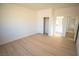 Bedroom features wood-look flooring and access to bathroom and closet at 521 Antelope Ave, Pahrump, NV 89060