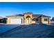 New single-story home with a two-car garage and neutral exterior at 521 Antelope Ave, Pahrump, NV 89060