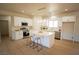 Beautiful kitchen with white cabinetry, stainless appliances, and spacious center island at 521 Antelope Ave, Pahrump, NV 89060