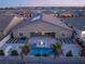 Aerial view of a home with a luxurious pool and backyard landscaping at 5260 Brayden Ct, Las Vegas, NV 89131