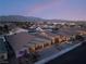 Community view including three-car garage home at 5260 Brayden Ct, Las Vegas, NV 89131