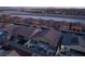 Aerial perspective of houses with solar panels, showcasing a community's design and landscaping at 5260 Brayden Ct, Las Vegas, NV 89131