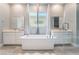 Elegant bathroom with soaking tub, double sinks, and walk-in shower at 5260 Brayden Ct, Las Vegas, NV 89131