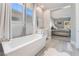 Bright bathroom with garden tub and views into the bedroom at 5260 Brayden Ct, Las Vegas, NV 89131