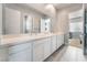 Modern bathroom with double vanity and white cabinets at 5260 Brayden Ct, Las Vegas, NV 89131