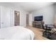 Spacious bedroom with large TV and built-in desk at 5260 Brayden Ct, Las Vegas, NV 89131