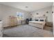 Bright bedroom featuring a king-size bed and built-in dresser at 5260 Brayden Ct, Las Vegas, NV 89131