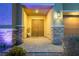 Inviting front entry with double doors and stone accents at 5260 Brayden Ct, Las Vegas, NV 89131