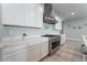 Modern kitchen with white cabinets and stainless steel appliances at 5260 Brayden Ct, Las Vegas, NV 89131