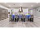 Modern kitchen with stainless steel appliances and blue-lit island at 5260 Brayden Ct, Las Vegas, NV 89131