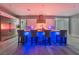 Modern kitchen with stainless steel appliances and blue-lit island at 5260 Brayden Ct, Las Vegas, NV 89131