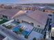 An aerial view of a backyard oasis with a sparkling pool and fire pit feature at 5260 Brayden Ct, Las Vegas, NV 89131