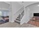 Bright and spacious entryway with tile floors and a staircase at 5313 Dawn Break Canyon St, North Las Vegas, NV 89031