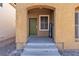 Inviting front entry with a green door and a welcome sign at 5313 Dawn Break Canyon St, North Las Vegas, NV 89031