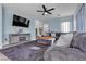 Spacious living room featuring a large sectional sofa and a modern fireplace at 5313 Dawn Break Canyon St, North Las Vegas, NV 89031