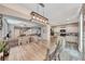 Bright dining area with a large wooden table, seamlessly connects to the living room and kitchen area at 5428 Brazelton St, North Las Vegas, NV 89081