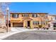 Two-story home featuring a well-manicured lawn, a two car garage and a classic Mediterranean-style roof at 5428 Brazelton St, North Las Vegas, NV 89081