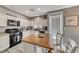 Kitchen with white cabinets, kitchen island, and stainless steel appliances at 5428 Brazelton St, North Las Vegas, NV 89081