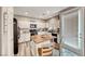 Well-equipped kitchen with white cabinets and an island at 5428 Brazelton St, North Las Vegas, NV 89081